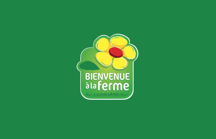 Logo de l’association « Bienvenue à la ferme » : une fleur sur fond vert.