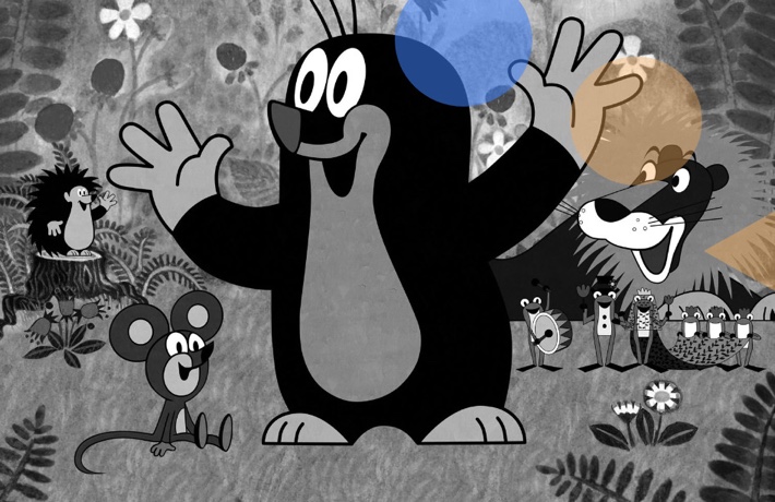 Extrait du film : la taupe au milieu d’autres animaux souriants dans un environnement végétal.